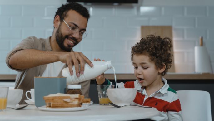 Goat milk children with father